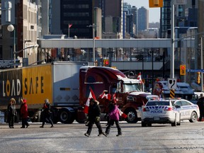 Protestors continue to clog downtown streets as truckers and supporters continue to protest against the COVID-19 vaccine mandates, in Ottawa, on Saturday, Feb. 5, 2022.