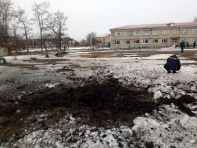 A view shows a crater, caused by shelling according to Ukraine's local officials, at the compound of a lyceum in the town of Vrubivka, in the Luhansk region, Ukraine, in this handout picture released February 17, 2022.