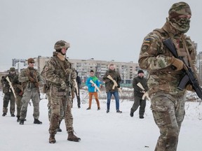 Veterans of the Ukrainian National Guard Azov battalion conduct military exercises for civilians amid threat of Russian invasion, in Kyiv, Sunday, Feb. 6, 2022.