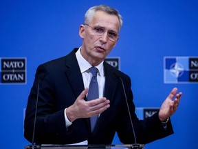 NATO Secretary General Jens Stoltenberg gestures as he delivers a speech during a press conference after a NATO video summit on Russia invasion of Ukraine at the NATO headquarters in Brussels on February 25, 2022.