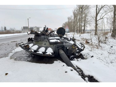 A fragment of a destroyed Russian tank is seen on the roadside on the outskirts of Kharkiv on Feb. 26, 2022, following the Russian invasion of Ukraine.