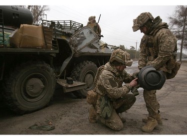 Ukrainian servicemen prepare a Swedish-British portable anti-tank guided missile NLAW before an attack in Lugansk region on Feb. 26, 2022.