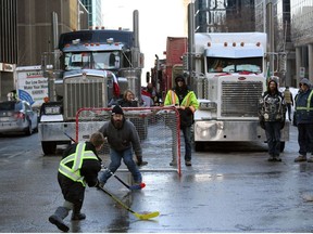 Protesters and supporters play street hockey as demonstrators continue to protest the vaccine mandates implemented by Prime Minister Justin Trudeau on February 7, 2022 in Ottawa, Canada.