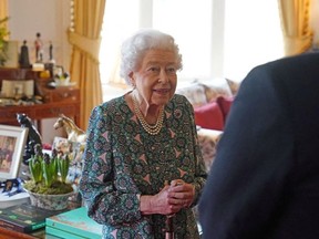 Britain's Queen Elizabeth speaks during an audience where she met the incoming and outgoing Defence Service Secretaries at Windsor Castle in Windsor, Britain, February 16, 2022.