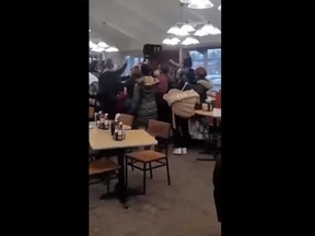 This screengrab of a video posted on Facebook shows a fight involving diners at a Golden Corral restaurant in Bensalem, Pa., last week.