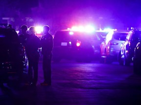 Police officers stand near the scene of a shooting at a church in Sacramento, California, U.S., February 28, 2022.