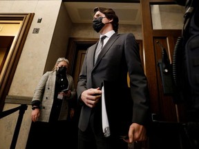 Canada's Prime Minister Justin Trudeau speaks with a journalist before Question Period in the House of Commons on Parliament Hill in Ottawa, Ontario, Canada February 15, 2022.