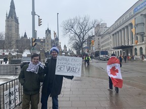 Carleton students Jacob Braun and Simon Xarchos are some of the Ottawa residents appearing downtown to counter-protest the "Freedom Convoy" demonstration.
