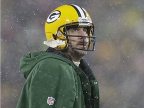 Green Bay Packers quarterback Aaron Rodgers looks on during a time out in the second during a NFC divisional playoff game against the San Francisco 49ers at Lambeau Field.