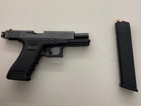 A man was allegedly in possession of this loaded handgun and drugs -- fentanyl and crack cocaine -- packaged for sale when he was arrested at Yonge and Dundas Sts. on Wednesday, Feb. 23, 2022.