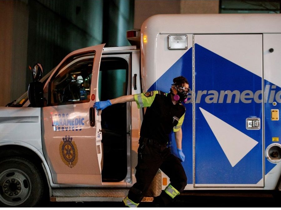 an ambulance crew delivers a patient to medical staff at mount sinai hospital on jan. 3, 2022.