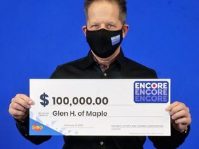 Glen Harper, of Maple, Ont., with his OLG cheque for $100,000 from Encore.