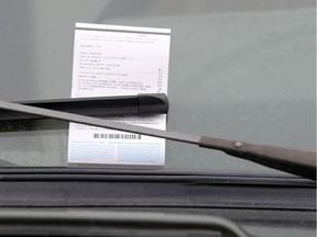 A parking ticket on a car window.