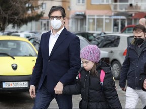 North Macedonia president Stevo Pendraovski walks bullied girl with Down syndrome to school