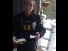 OPP Const. Erika Ingram visits Facebook user Nadine Ellis-Maffei at her Peterborough County farm to deliver a pamphlet outlining what "you can" and "can't do" at protests.