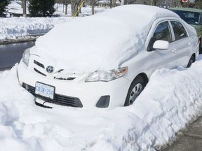 The city says it's ready to face this week's snowstorm even though crews still haven't finished cleaning up from the last blizzard. The car above, photographed on Feb. 1, 2022, provides an example of the work that still needs to be done.