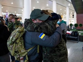TBILISI, GEORGIA - FEBRUARY 28: Georgian civilian volunteers say goodbye to friends and family at Tbilisi international airport before their scheduled flight to Poland, where they plan to cross to Ukraine to join Ukraine's army.