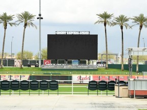 A detail of the blank scoreboard and empty seats at Goodyear Ballpark in Goodyear, Ariz., March 12, 2020.
