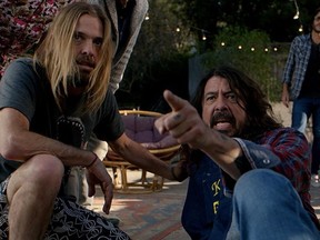 Taylor Hawkins, left, Dave Grohl and Rami Jaffee playing themselves in Studio 666.