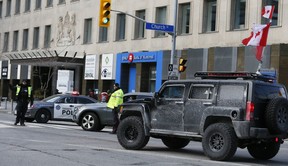 Trucks with Canadian flags and other vehicles are blocked at Church and Bloor Sts. on Saturday, Feb. 12, 2022.