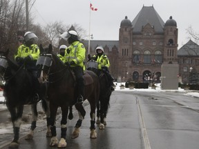 Toronto Police prepare for a possible trucker protest in the area of Queen's Park on Friday, Feb. 11, 2022.