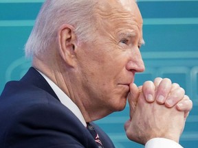 U.S. President Joe Biden listens during a virtual roundtable on securing critical minerals at the White House in Washington, U.S., February 22, 2022.