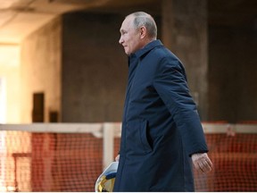 Russian President Vladimir Putin visits the construction site of the National Space Agency on the premises of the Khrunichev State Research and Production Space Centre, in Moscow, Russia February 27, 2022.