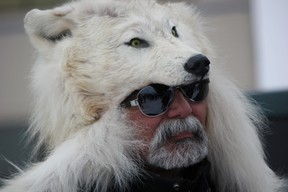 A man stays warm while taking in the fur action during Fur Rondy in Anchorage. IAN SHANTZ/TORONTO SUN