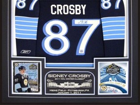 A signed Sidney Crosby jersey in a frame similar to this was stolen Tuesday in Chatham. The frame with the stolen jersey has a photo in the bottom left of Crosby and Alex Ovechkin. (Police provided image)