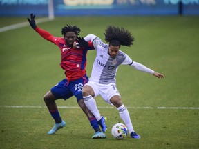 Toronto FC's Jayden Nelson defends against FC Dallas midfielder Ema Twumasi.