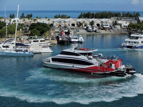 A passenger ferry leaves near the port of Hamilton, Bermuda on July 15, 2013.