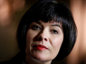 Ginette Petitpas Taylor listens to a question during a news conference on Parliament Hill in Ottawa.