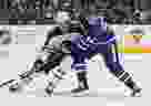 Patrik Laine, then with the Winnipeg Jets, skates against Auston Matthews of the Toronto Maple Leafs.