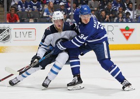 Patrik Laine, then with the Winnipeg Jets, skates against Auston Matthews of the Toronto Maple Leafs.