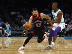 Fred VanVleet of the Toronto Raptors dribbles the ball as Terry Rozier of the Charlotte Hornets defends.