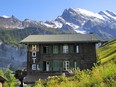 Hotel Mittaghorn in the Swiss village of Gimmelwald is a black-stained chalet with eight balconies, huge views.