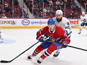 Michael Pezzetta of the Montreal Canadiens and Jake Muzzin of the Toronto Maple Leafs skate against each other during the second period at the Bell Centre on Feb. 21, 2022 in Montreal.