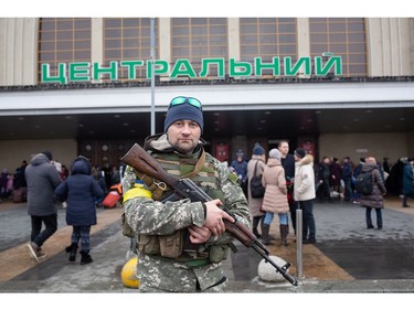 A Ukrainian serviceman stands guard outside the central railway station on March 1, 2022 in Kyiv, Ukraine.