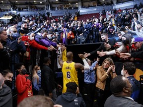 LeBron James of the Los Angeles Lakers leaves the court following their NBA game victory against the Toronto Raptors at Scotiabank Arena on March 18, 2022 in Toronto.