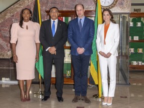 Prince William, Duke of Cambridge (second from right) and Catherine, Duchess of Cambridge (right) pose for a photograph with the Prime Minister of Jamaica, Andrew Holness (second from left) and his wife Juliet (left) during a meeting at his office on March 23, 2022 in Kingston, Jamaica.