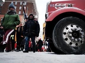 "Freedom Convoy" supporters are pictured as they gathered and blocked streets to take part in an anti-government and anti-vaccine mandate protest on Feb. 12, 2022 in Ottawa.