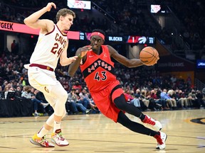 Pascal Siakam #43 of the Toronto Raptors drives to the basket around Lauri Markkanen #24 of the Cleveland Cavaliers during the second quarter at Rocket Mortgage Fieldhouse on Sunday.