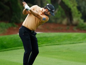 Canada's Adam Hadwin plays a shot on the 14th hole during the continuation of the first round of THE PLAYERS Championship on the Stadium Course at TPC Sawgrass on Friday. Hadwin didn't get to complete his first round because of rain.
