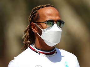 BAHRAIN, BAHRAIN - MARCH 18: Lewis Hamilton of Great Britain and Mercedes walks in the Paddock before practice ahead of the F1 Grand Prix of Bahrain at Bahrain International Circuit on March 18, 2022 in Bahrain, Bahrain.