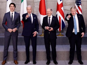 Canada's Prime Minister Justin Trudeau, U.S. President Joe Biden, Germany's Chancellor Olaf Scholz and British Prime Minister Boris Johnson pose for a G7 leaders' family photo during a NATO summit on Russia's invasion of Ukraine, at the alliance's headquarters in Brussels, on March 24, 2022 in Brussels, Belgium.