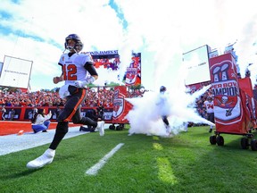 Tom Brady of the Tampa Bay Buccaneers runs onto the field before the game against the Los Angeles Rams.