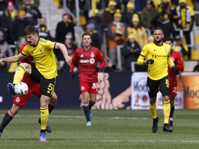 Columbus Crew defender Miloš Degenek (5) controls the ball during the first half against the Toronto FC at Lower.com Field on Saturday.