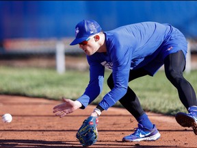 Infielder Cavan Biggio, fielding ground balls during the first day of spring training workouts at the team’s player development complex in Dunedin, admits his versatility means he could wind up playing an assortment of positions — including in the  outfield — for the Blue Jays this season.