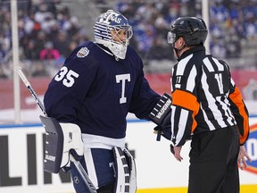 Mar 13, 2022; Hamilton, Ontario, CAN; Toronto Maple Leafs goaltender Petr Mrazek (questions referee Kelly Sutherland about the fourth goal by the Buffalo Sabres during the third period in the 2022 Heritage Classic ice hockey game at Tim Hortons Field.