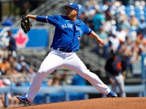 Blue Jays starting pitcher Hyun Jin Ryu throws a pitch in the first inning against the Detroit Tigers during spring training at TD Ballpark.